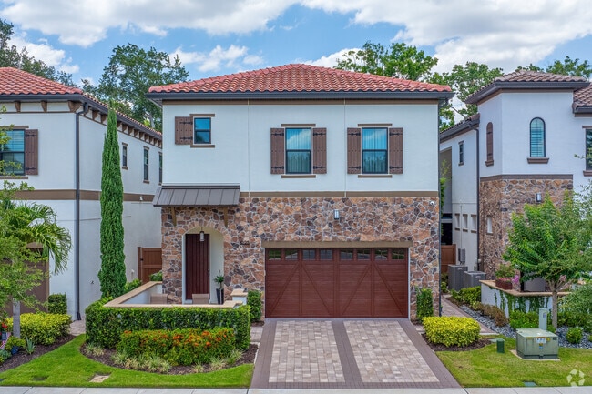 Beautiful craftsmanship is evident in the brickwork and driveway of this Dr. Phillips home.