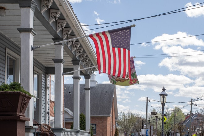 Some residents in Southampton proudly fly an American flag.