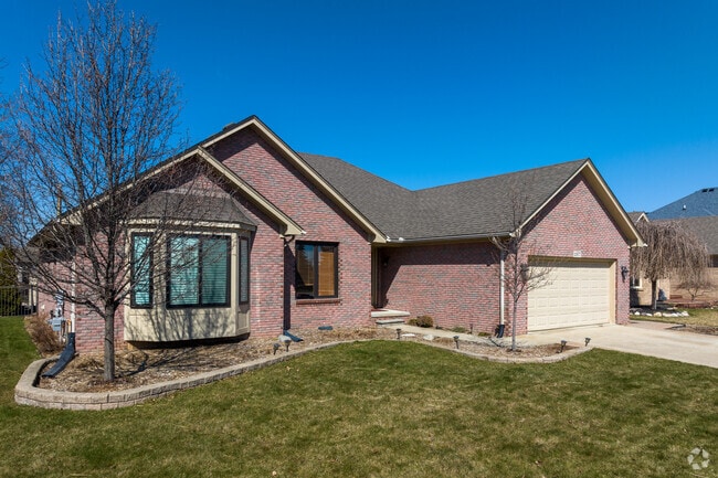 Craftsman style homes with stone details are common in Macomb Township.