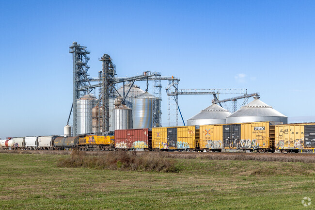 Train passing by near silos just outside of Virgil, Illinois.
