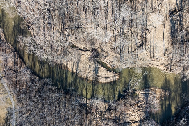 Colonial Park has wooded trails, picnic areas, and scenic views of Root River.