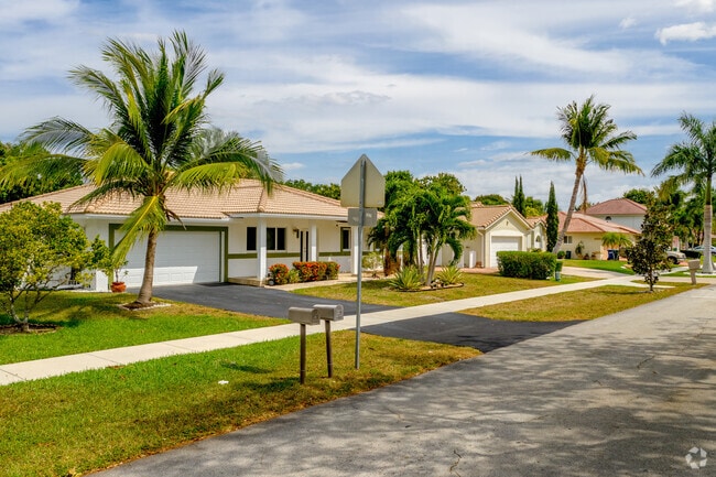 Palm trees adorn these beautiful ranch homes in the City of Coral Springs, FL.