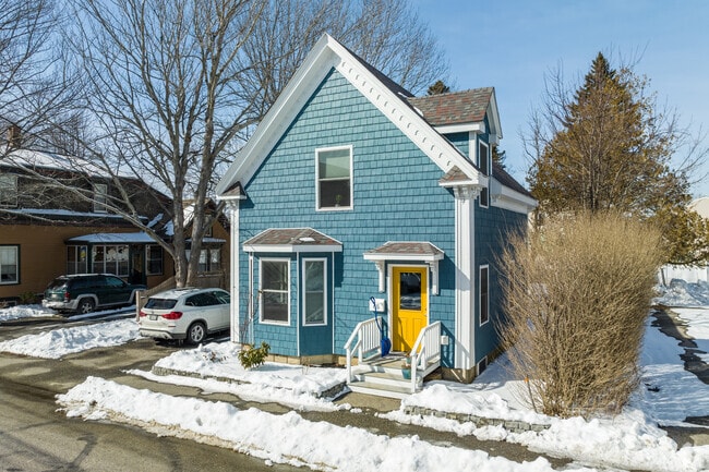 This brightly colored home with a yellow front door stands out in Knightville.