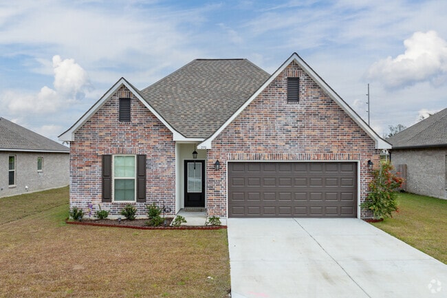 New traditional brick homes in Gray come with two-car garages.