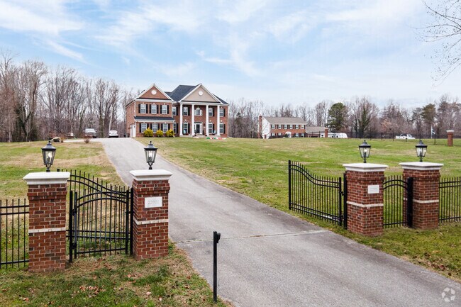 Private gated Neo-Classical residences with large yards are common in S Prince George's County.