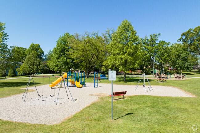 Children enjoy the playground at Oxford Park in Southwest Outer Drive.