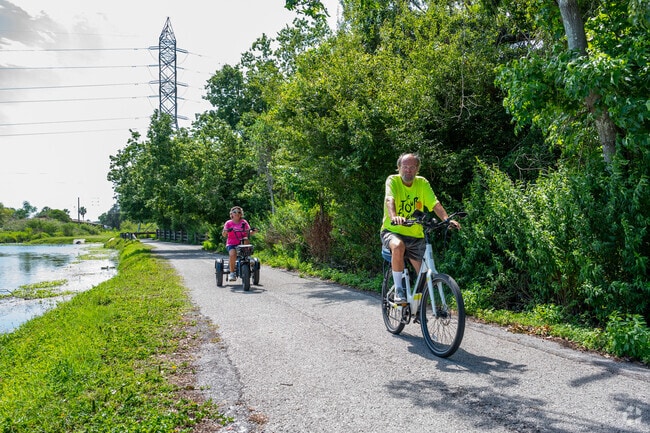 Locals cycle the paths at Largo Central Park Nature Preserve for exercise.
