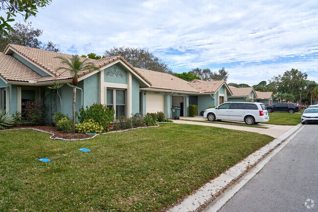 Well-manicured lawns are a frequent sight in the White City neighborhood.