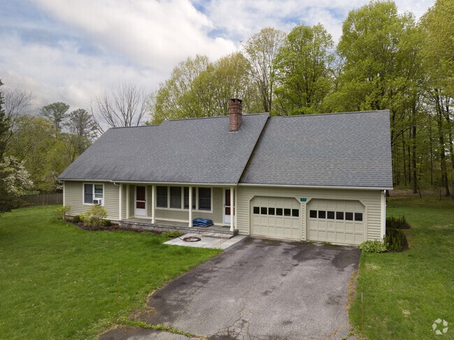 A large ranch-style home with a two-car garage in Sharon, Connecticut.