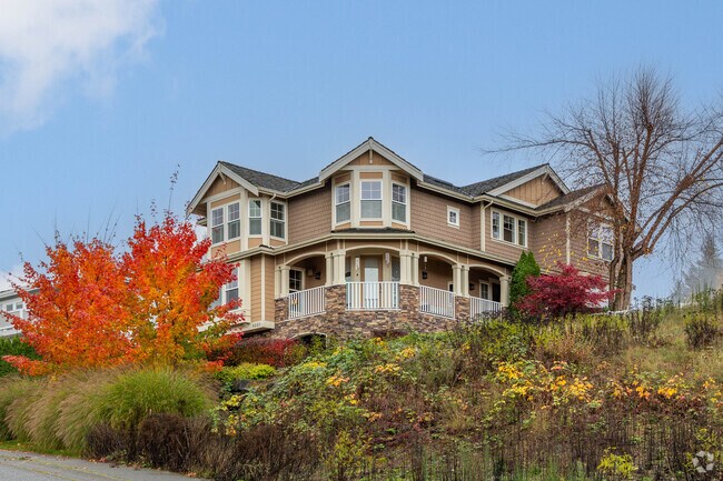 Some homes on the hills of Rainier Crest utilize wraparound porches to soak in the view.