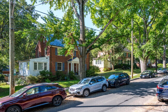 Many homes are shaded by tall, lush trees in Wakefield.