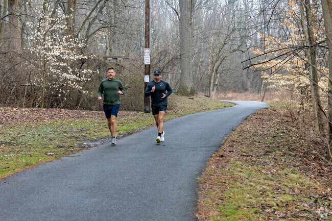 Run with a friend on the paved trail in Pennypack Park in Fox Chase.