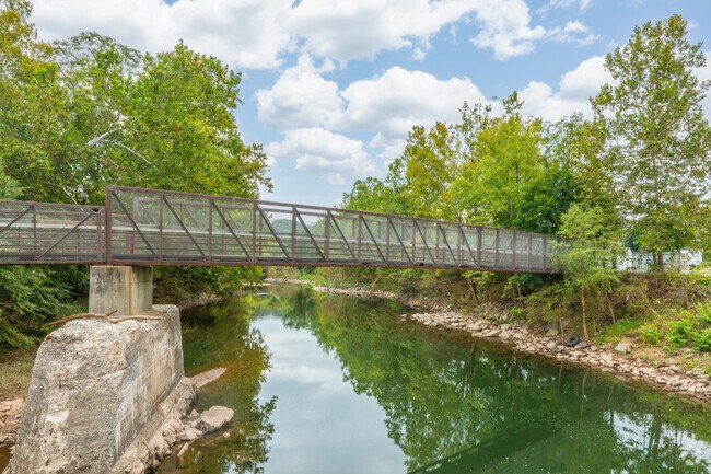 A pedestrian bridge along the Lycoming Creek Bikeway crosses Lycoming Creek.