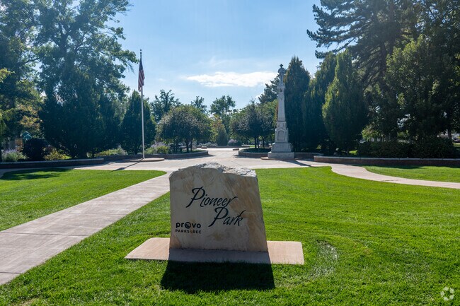 Trees line the walking paths at Pioneer Park, a family-friendly spot in west Provo.