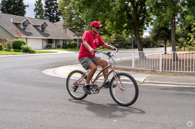 A Woodbridge local bikes along River Meadows Drive.