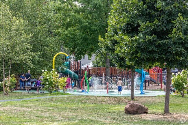 Kids enjoy the water splash at Benson Park, a fun summer attraction in Passaic.