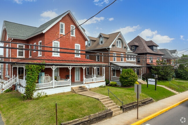 Large Victorian-style front porches are a prominent feature on homes in New Holland.