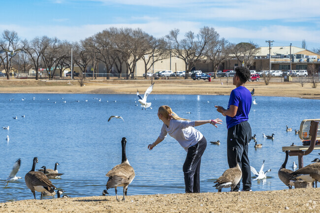 Clovis locals enjoy an afternoon fishing and feeding the ducks at Greene Acres Park.