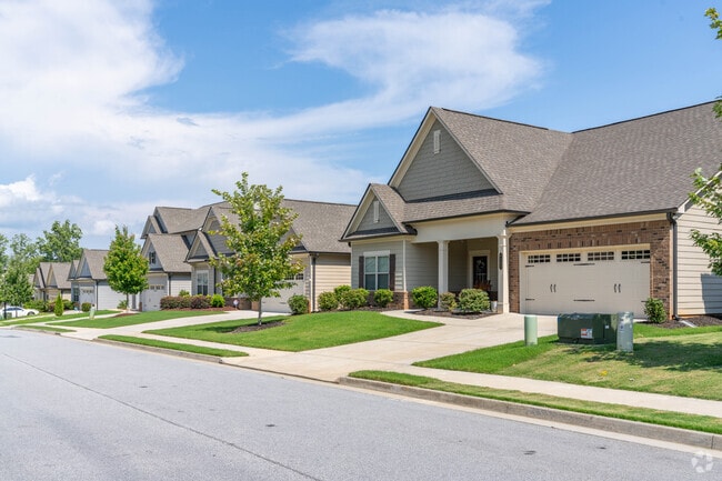 Homes with multiple close eaves and a roomy garage are an attractive addition to Mundy Mill.