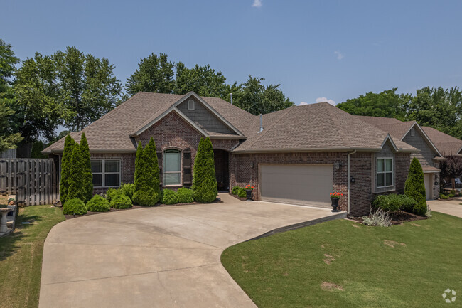 Well-maintained shrubs frame this craftsman home in Copper Creek neighborhood.