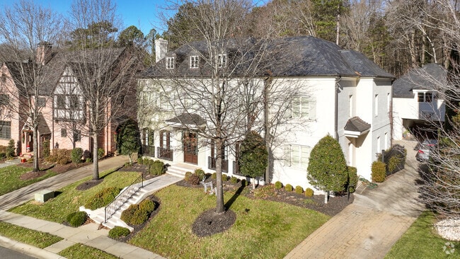 Elegant stairs and double doors make for a grand entrance
