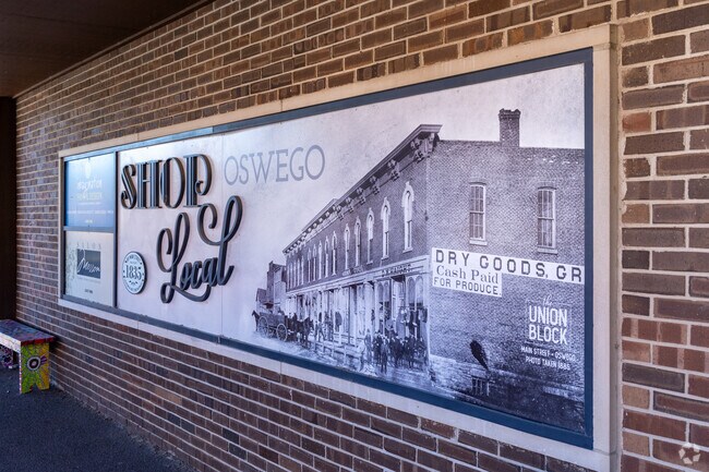 Old mural in downtown Oswego where you can shop local.
