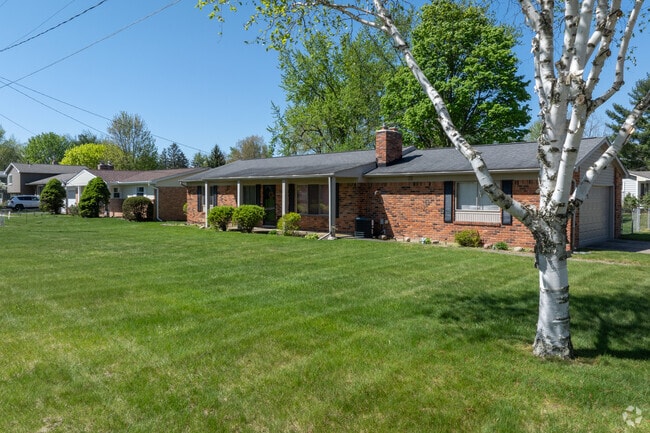 Large brick ranch homes neatly line the streets of Holly.