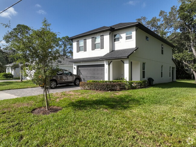 An adorable, new traditional style property with exceptional views on Lake Jasmine.