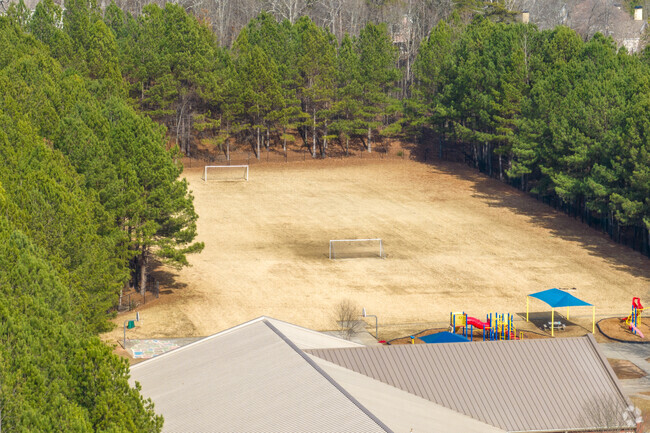 Hillside Elementary School features open field and play structures.