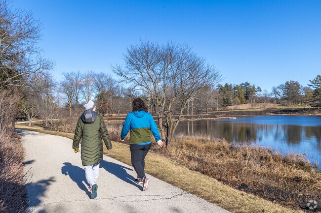 Lisle residents enjoy a walk around the large lake at The Morton Arboretum.