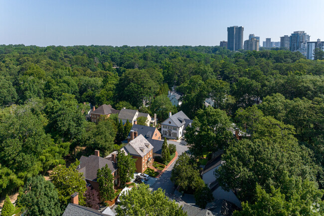 Peachtree Battle is fairly densely populated, but is nestled within trees and greenery.