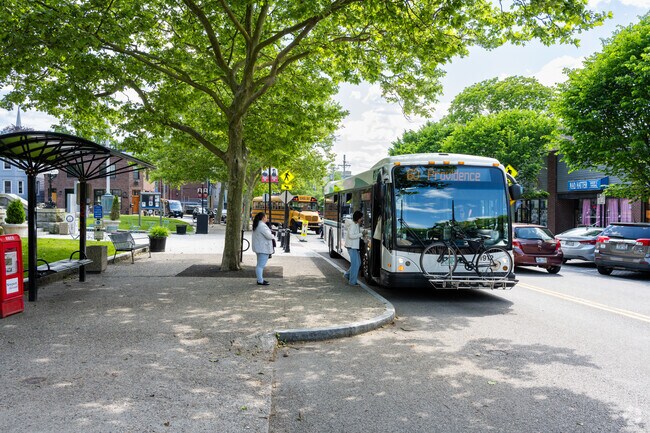 Take the local RIPTA public transportation to Providence, near Newport City Hall in Newport, RI.