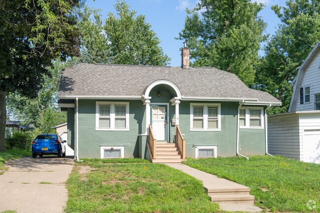 This Vernon Heights bungalow is a one-story design with a welcoming front and warm details.