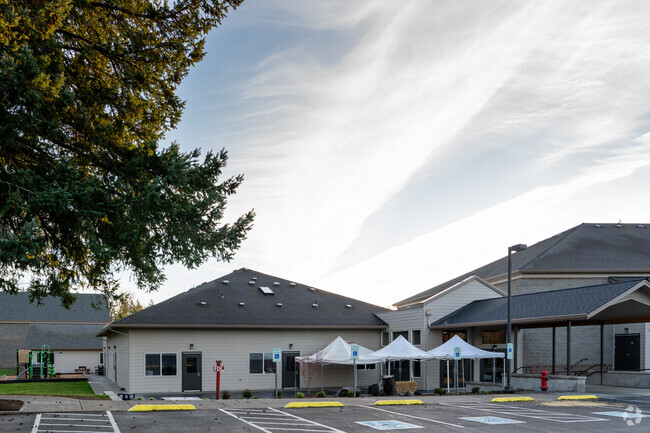 The back entrance featuring covered seating.