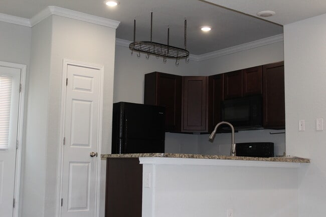 Kitchen with black cabinets