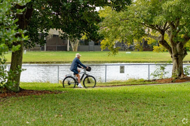 A man takes a bike ride in New River Estates in Sunrise, FL.