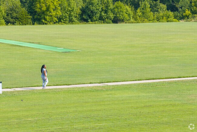 A Todd Park resident enjoys a walk on the trails at Robert Smith Park.