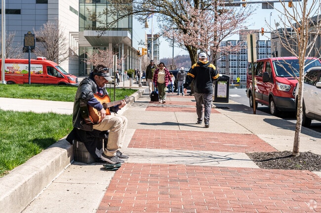 A guitarist busks on Hamilton St in nearby downtown Allentown.