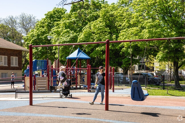Gladstone Park has swings and a full playground for kids.
