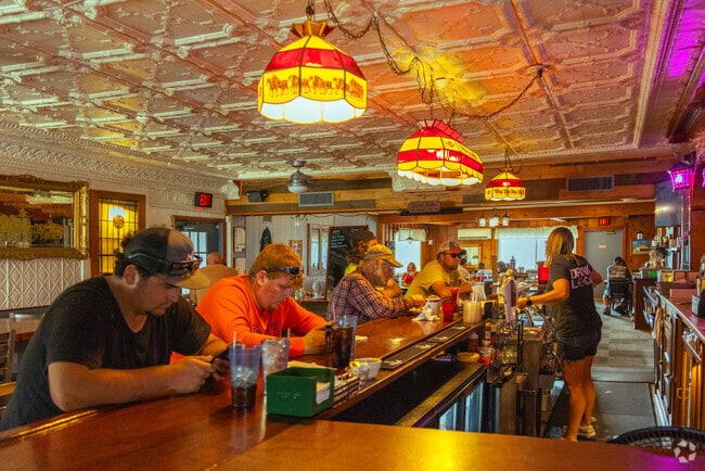Guests dine at the bar inside Local Folks Restaurant & Pub.