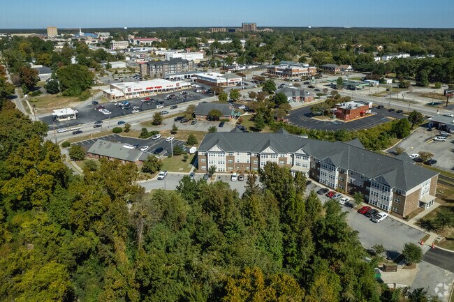 A moderately sized business area is located next to Forest Hills.