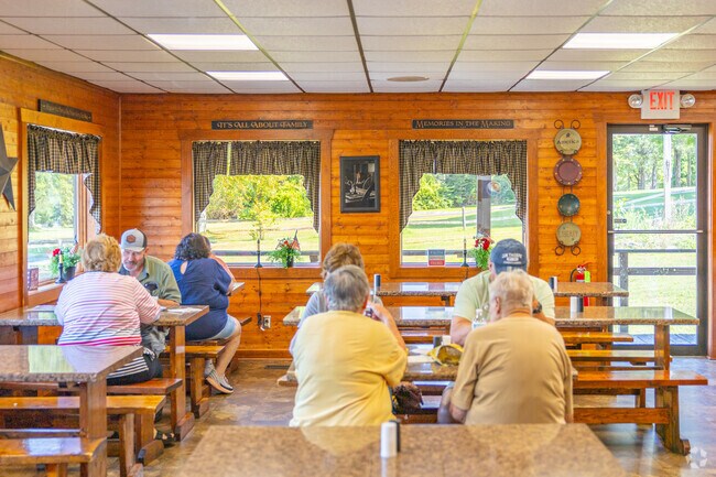 Dine inside a log cabin feel for a quick lunch in Muncy at Halls Station Sub Stop.