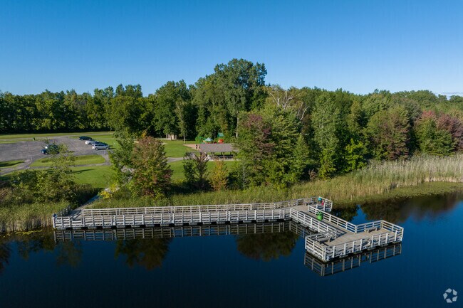 Families are fishing on the pier at Buell Lake Park.