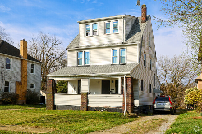 A craftsman with a large dormer stands out amongst the other craftsman bungalows in Schenley.