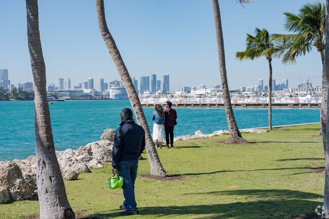 Residents enjoy skyline views from South Pointe Park near Star, Palm and Hibiscus Islands.