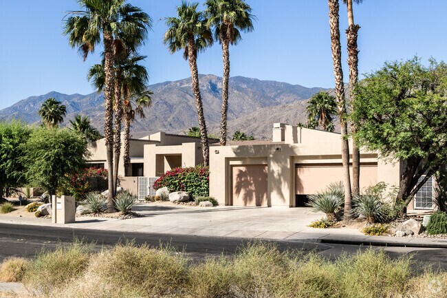 Palm trees tower over the iconic mid-century architecture of Andreas Hills.