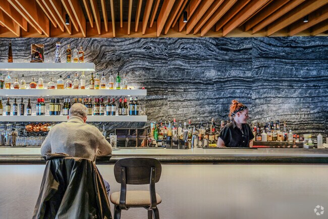 A man enjoys a mid-afternoon beverage at the bar in Heck's of Beachwood.