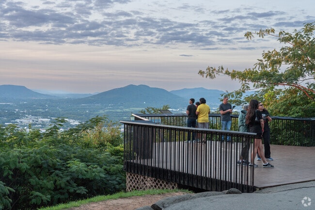Blue ridge parkway has trails with overlooks that point towards the city.