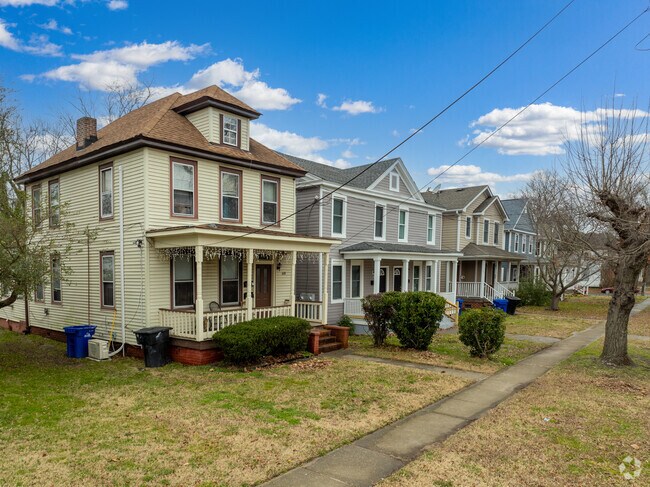 Many two-story, colonial-influenced homes are well-kept and over a century old.
