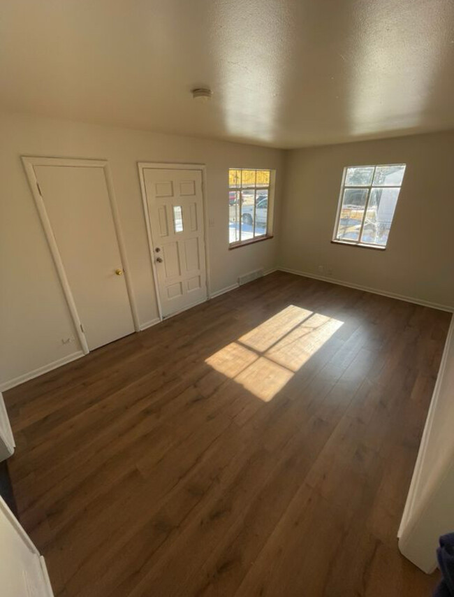Sunny living area with new flooring